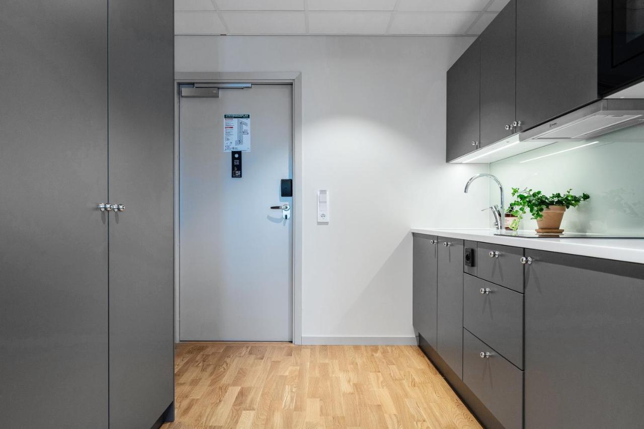 Biz Apartment Bromma Stockholm Kültér fotó A typical kitchen in a student apartment