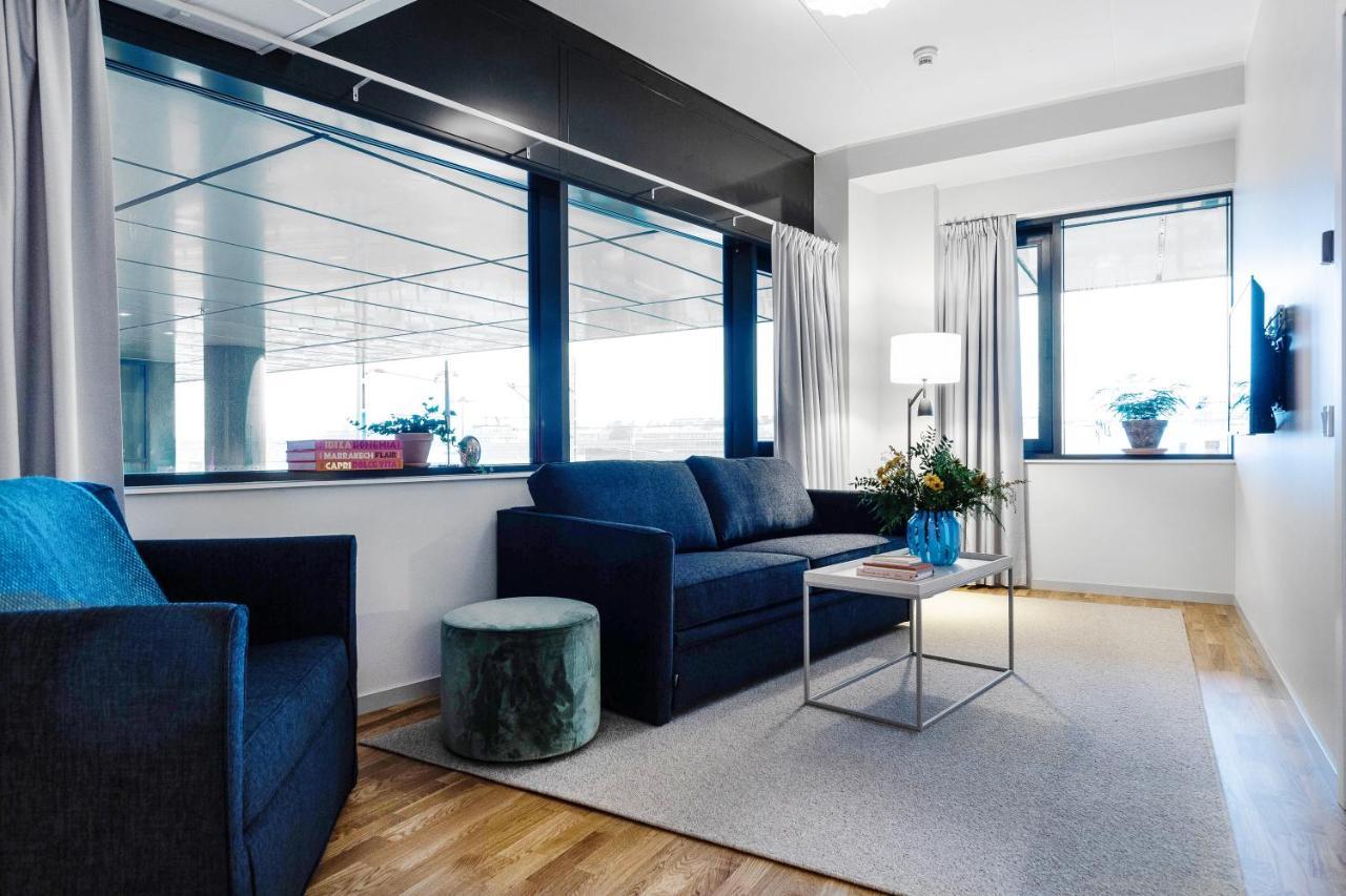 Biz Apartment Bromma Stockholm Kültér fotó A living room in a serviced apartment